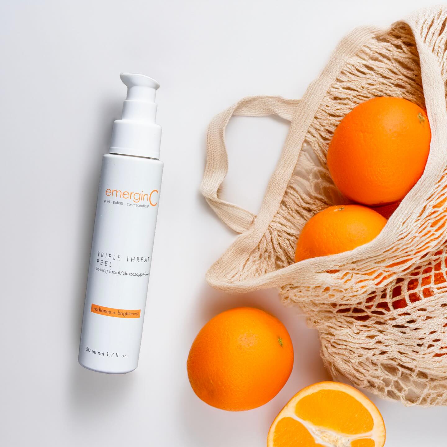 emerginC Radiance + Brightening Triple Threat Peel Flatlay with Oranges