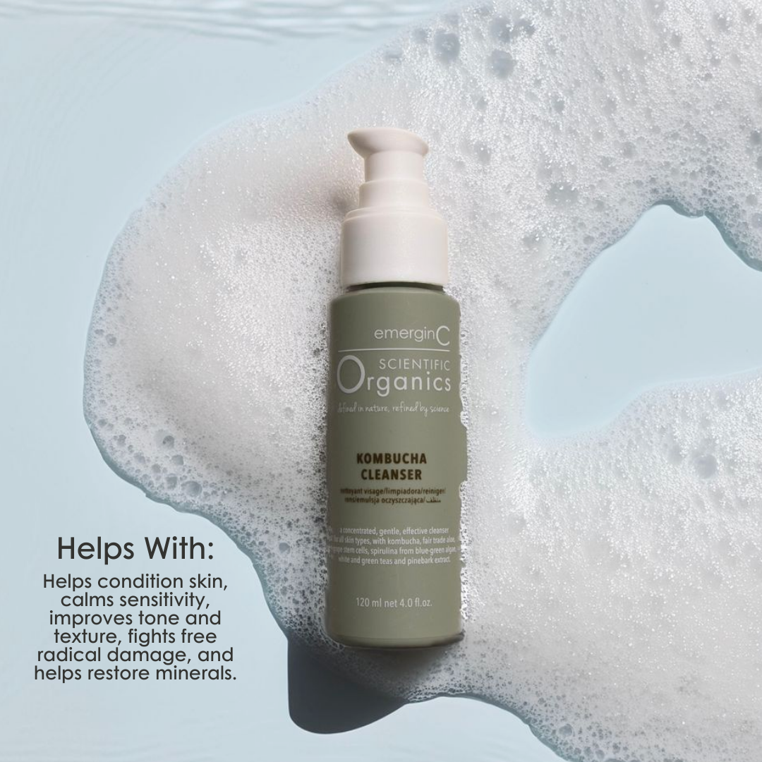 emerginC Scientific Organics Kombucha Cleanser 120ml gentle facial cleanser surrounded by foam texture on a blue background. Helps condition skin, calm sensitivity, improve tone and texture, fight free radical damage and restore minerals.
